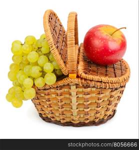 grapes and apples in the basket isolated on a white background