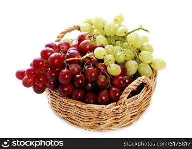 Grapes in a basket isolated on white background