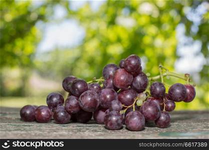 grapes in wooden table, outdoor
