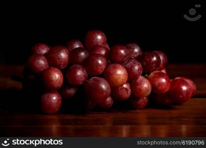 Grapes on wooden table, studio picture