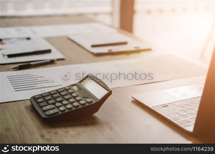 graph chart document calculator on accountant office desk table