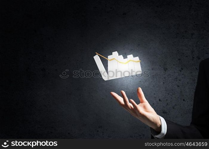 Graph on hand. Hand of businessman showing business growth concept