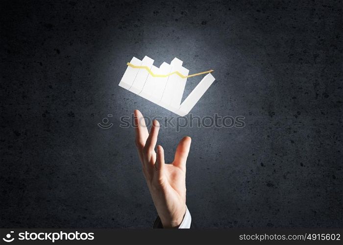 Graph on hand. Hand of businessman showing business growth concept