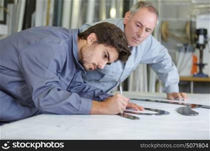 graphic artist drawing on the plank