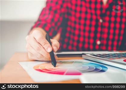 Graphic designer Brainstorming drawing on graphics tablet at workplace