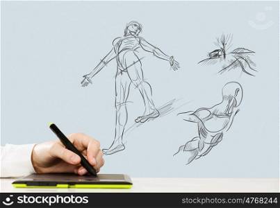 Graphic designer. Close up of human hand using tablet for drawing