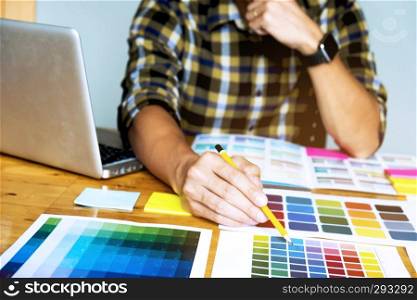 Graphic designers choose colors from the color bands s&les for design .Designer graphic creativity work concept . 