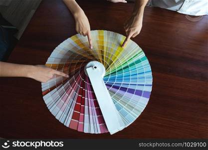 Graphic designers choose colors from the color bands samples for design .Designer graphic creativity working concept.