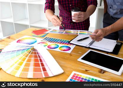 Graphic designers choose colors from the color bands samples for design .Designer graphic creativity working concept .