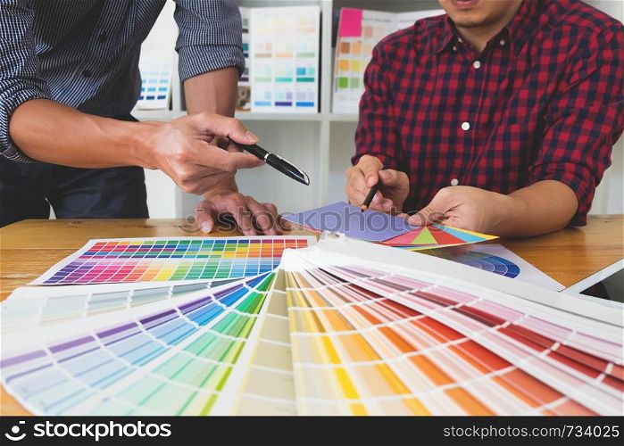 Graphic designers choose colors from the color bands samples for design .Designer graphic creativity working concept .