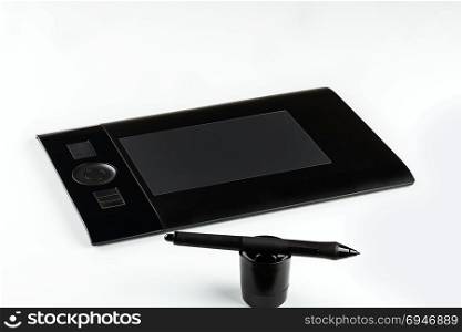 graphic tablet with pen and holder on white background