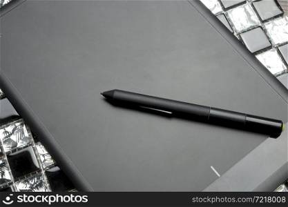 graphic tablet with pen for illustrators and designers, isolated on white background.. Graphic tablet on a table.