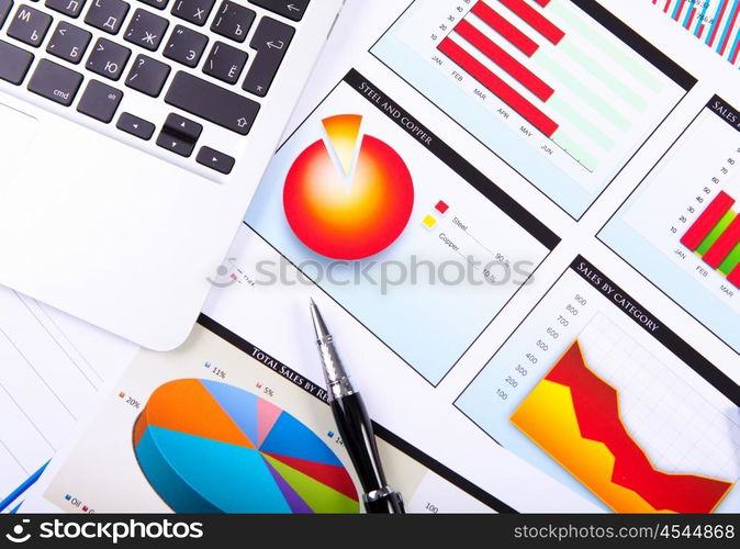 Graphs, charts, business table. The workplace of business people.