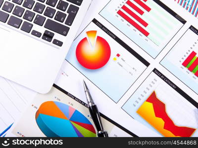 Graphs, charts, business table. The workplace of business people.