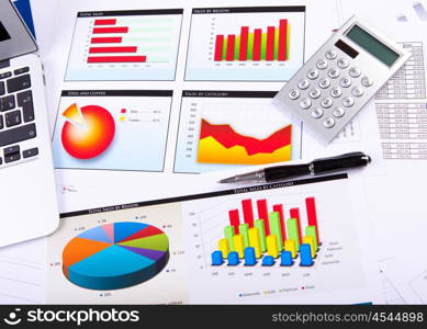 Graphs, charts, business table. The workplace of business people.