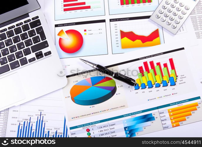 Graphs, charts, business table. The workplace of business people.