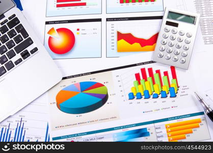 Graphs, charts, business table. The workplace of business people.