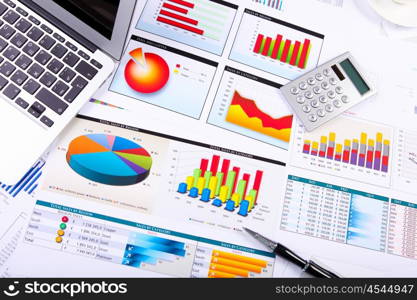 Graphs, charts, business table. The workplace of business people.