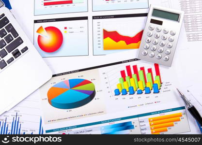 Graphs, charts, business table. The workplace of business people.