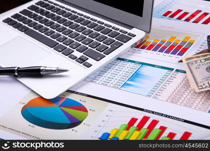 Graphs, charts, business table. The workplace of business people.