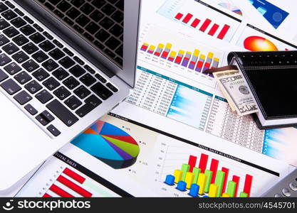 Graphs, charts, business table. The workplace of business people.