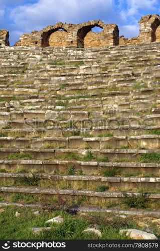 Grass and rows on seats in old stadium in Aphrodisias, Turkey