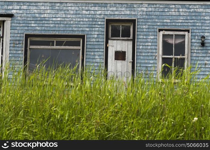 Grass in front of abandoned house, Guysborough, Nova Scotia, Canada