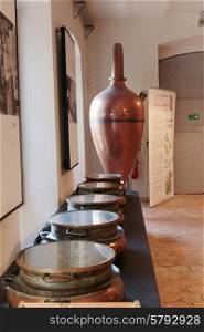 GRASSE, FRANCE - OCTOBER 31, 2014: Ancient distiller for the production of perfume in Fragonard factory