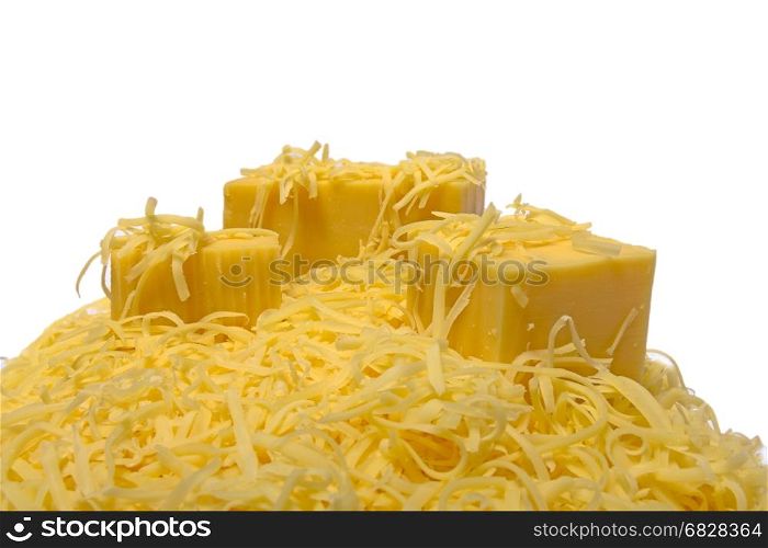 grated and chunks of hard cheese on a white background