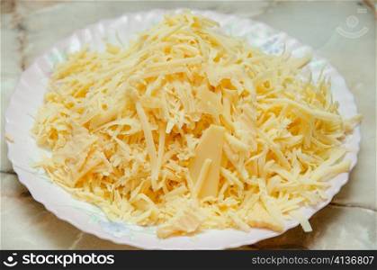 grated cheese at plate