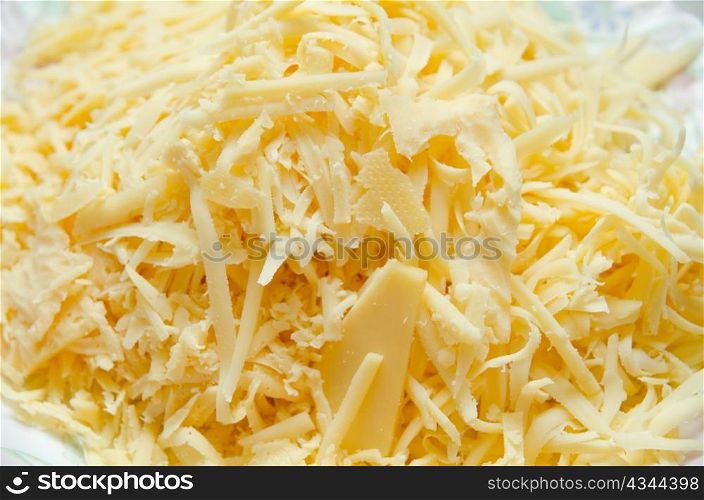 grated cheese at plate