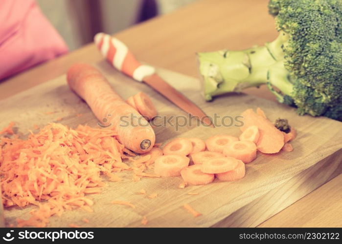 Grated orange carrot prepared for healthy meal salad. Vegetables, dieting food concept.. Grated orange carrot for salad