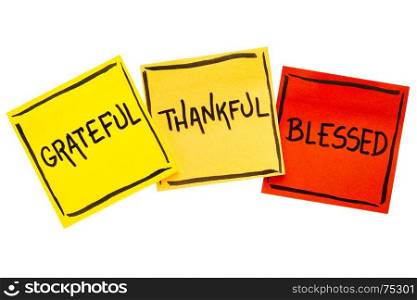 Grateful, thankful, blessed spiritual words - handwriting in black ink on isolated sticky notes