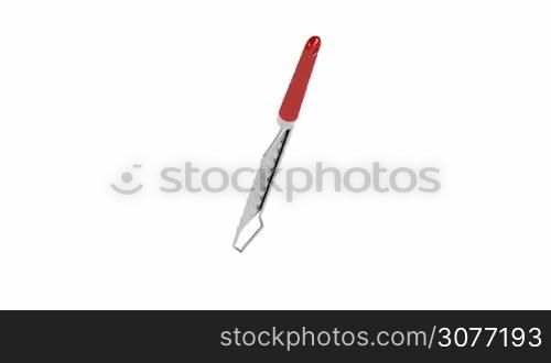Grater spins on white background