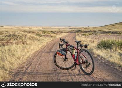 gravel bike on a dirt road in Colorado prairie - Sand Wash trail in Soapstone Prairie Natural Area near Fort Collins, Colorado