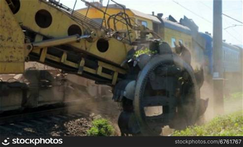 Gravel-cleaning machine by railway