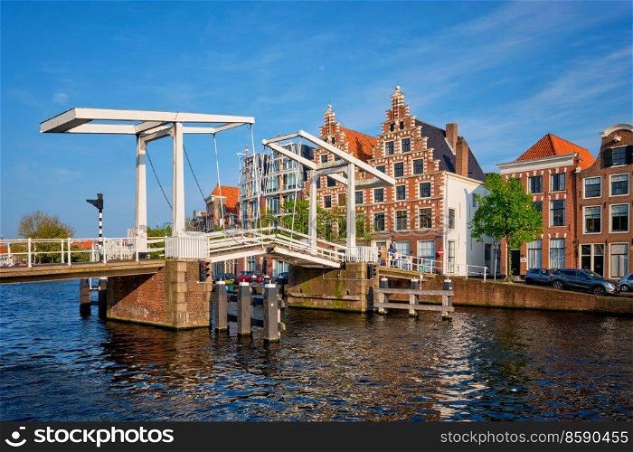 Gravestenenbrug bridge on Spaarne river and old houses in Haarlem, Netherlands. Gravestenenbrug bridge in Haarlem, Netherlands
