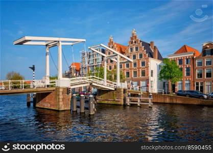 Gravestenenbrug bridge on Spaarne river and old houses in Haarlem, Netherlands. Gravestenenbrug bridge in Haarlem, Netherlands