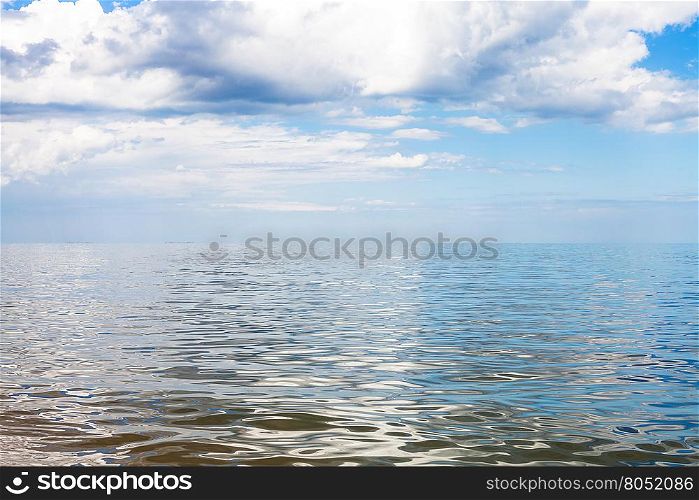 gray and white clouds over calm water of Azov Sea, Temryuk bay, Golubitskaya resort, Taman peninsula, Kuban, Russia