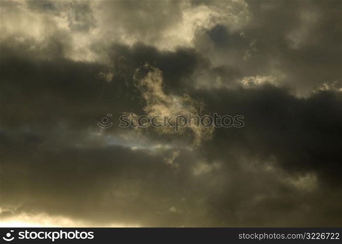 Gray And Yellow Clouds Filling The Sky