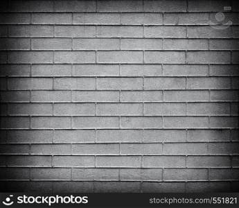 Gray Brick wall with darkened edges . Top view. Modern brick wall wallpaper design for web or graphic art projects. Abstract background for business cards and covers. Template or mock up.. Gray Brick wall texture close up. Top view.