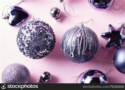 Gray Christmas festive decorations on pink background close up. Gray Christmas decorations on pink
