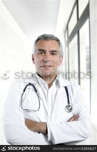gray hair expertise handsome senior doctor hospital portrait white corridor