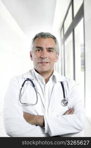 gray hair expertise handsome senior doctor hospital portrait white corridor