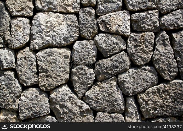 gray limestone masonry wall typical from Majorca style in Spain