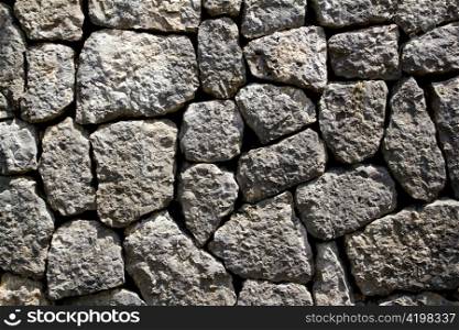 gray limestone masonry wall typical from Majorca style in Spain