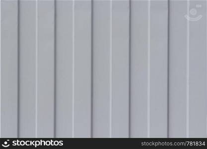 Gray metal corrugated sheet as background and texture.