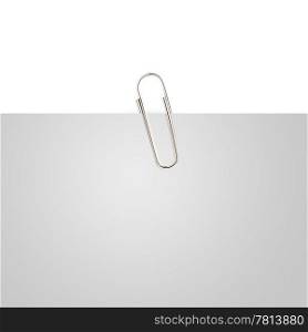 Gray note paper with paper clip on white background.. Glass bottle