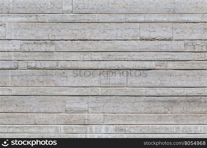 Gray stone wall closeup background of photo texture