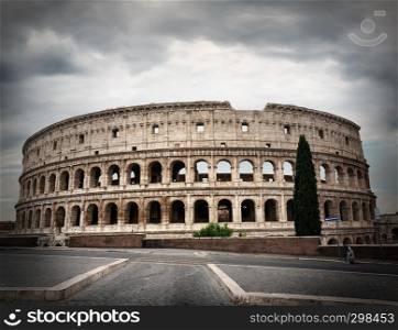 Gray thunder clouds over ancient Colosseum in Rome